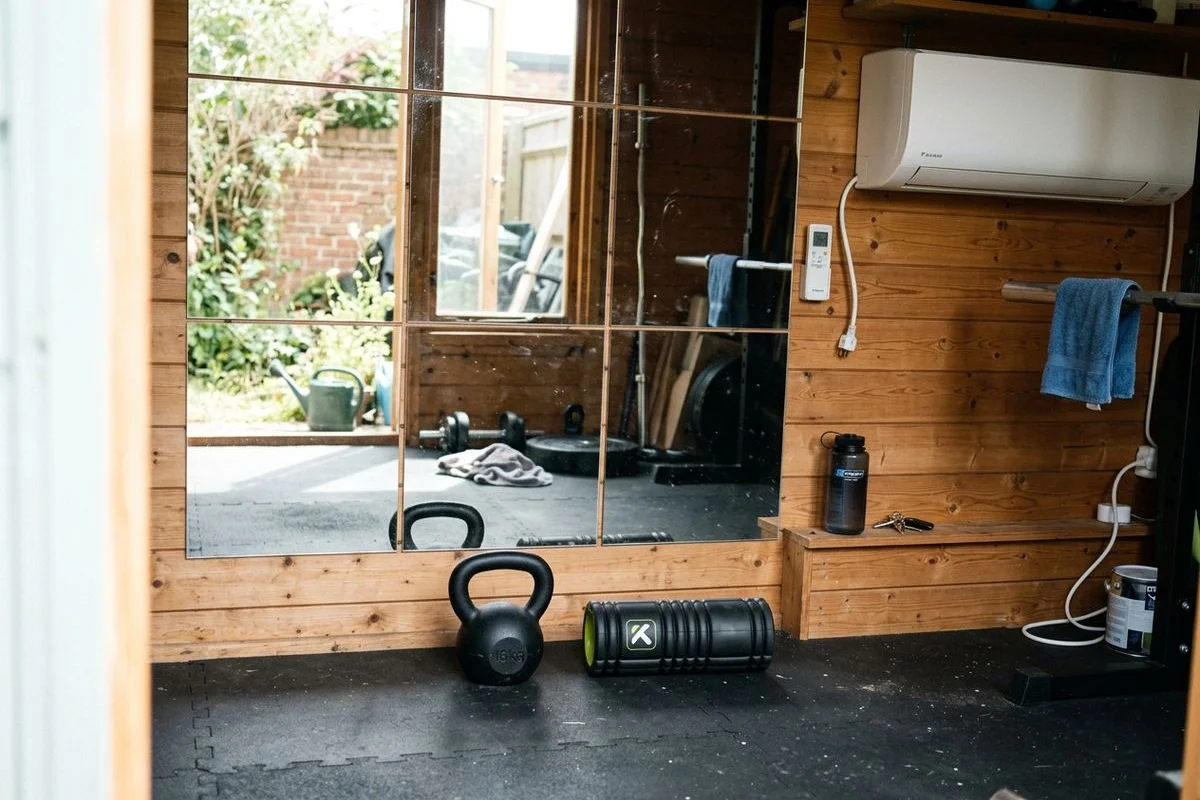 Full-height mirrors, rubber matting and air conditioning in a garden gym